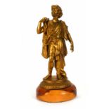 A 19th/20th century gilt painted spelter figure of a Neo-Classical fisherman on a yew base, h. 32 cm