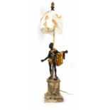 An Art Deco style table lamp, the frosted glass shade suspended by a brass shaft beside a bronze