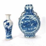 A 20th century blue and white Chinese moon flask with dragon handles, decorated with warrior scenes,