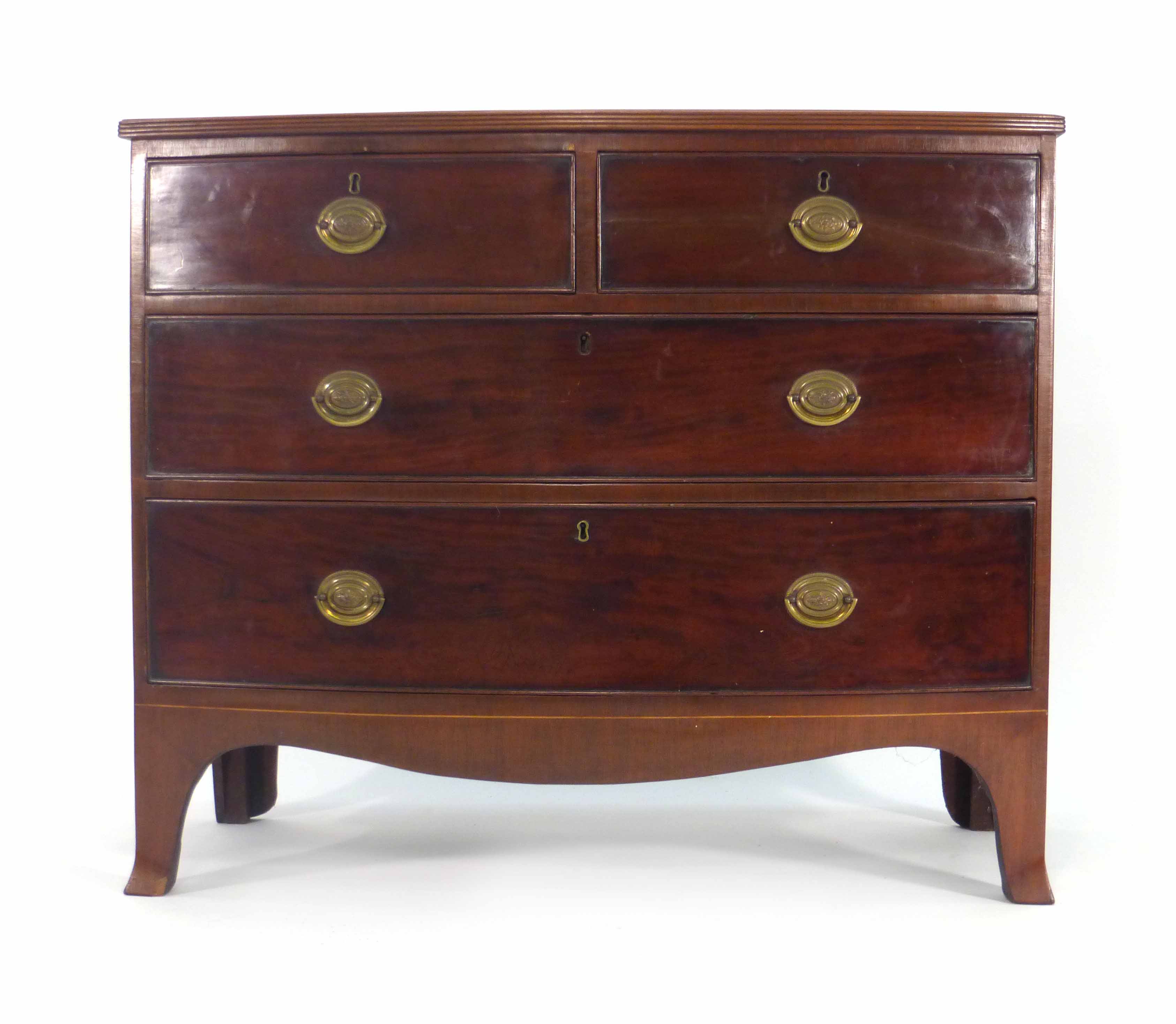 A George III mahogany and strung bow fronted chest of two short and two long graduated drawers