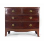 A George III mahogany and strung bow fronted chest of two short and two long graduated drawers