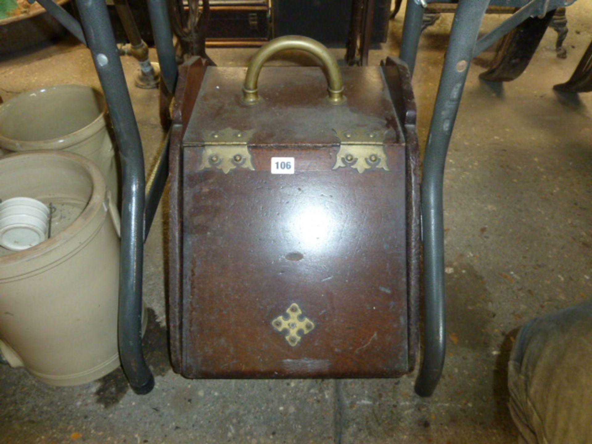 A mahogany and brass coal scuttle