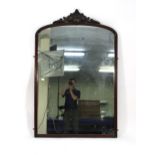 A Victorian wall mirror, the plate of rectangular cushioned form within a mahogany frame with a