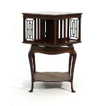 An Edwardian mahogany revolving bookcase on a square stand with cabriole legs, d. 46 cm CONDITION