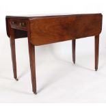 A Victorian mahogany and strung Pembroke table, having a single and dummy drawer on slender tapering