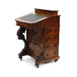 A 19th century walnut and inlaid davenport with fitted inkwell, tooled leather surface and an