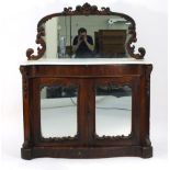 A 19th century rosewood credenza of serpentine form, the mirror back above a marble surface and