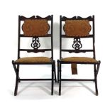 A set of four Edwardian beech and upholstered campaign-type folding chairs CONDITION REPORT: