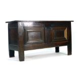 An 18th century panelled oak coffer on rectangular straight stiles, l. 131 cm CONDITION REPORT: