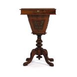 A 19th century mahogany sewing table, the lift lid enclosing a fitted interior on a turned support