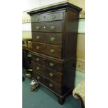 A George III mahogany chest on chest with dental block cornice over seven graduated drawers on