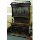 An 18th century-style oak cupboard, the two panelled doors over an open gallery, two drawers and two