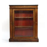 A 19th century walnut and inlaid pier cabinet on a plinth base, w. 74 cm CONDITION REPORT: Top