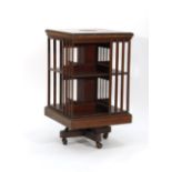 An Edwardian mahogany and strung revolving bookcase of typical form, d. 50 cm CONDITION REPORT: In