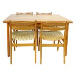 A 1960's teak rectangular extending dining table on four circular straight legs, l.