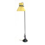 A 1970's half height tubular standard lamp with adjustable shade CONDITION REPORT: Will require re-