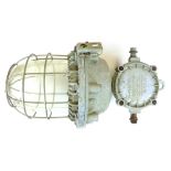A Polish industrial light fitting with steel grill and moulded glass shade  CONDITION REPORT:
