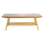 An Ercol elm two tier coffee table on beech circular tapering legs, l. 104 cm CONDITION REPORT: Some