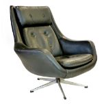 A black leather armchair on a chromed five star swivel base CONDITION REPORT: Some cracking and wear