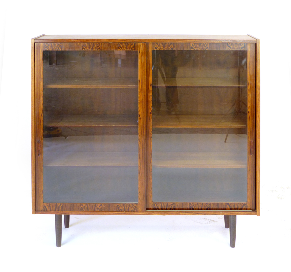 A 1960's rosewood bookcase with twin glazed sliding doors and six adjustable shelves on circular - Image 3 of 13