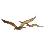 A treen figural wall plaque in the form of two stylised birds in flight, l. 124 cm CONDITION REPORT: