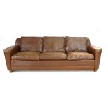 A brown leather three seater sofa on beech sleigh type feet CONDITION REPORT: One arm badly