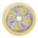 A 1930's Carter, Stabler & Adams Poole pottery plate decorated with yellow, blue and green floral