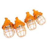 A set of four CCCP industrial bunker-type ceiling lights with steel grills and moulded glass