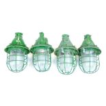 A set of four CCCP industrial bunker-type ceiling lights with steel grills and moulded glass