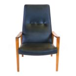 A 1970's teak framed and black vinyl armchair on square tapering legs  CONDITION REPORT: No rips