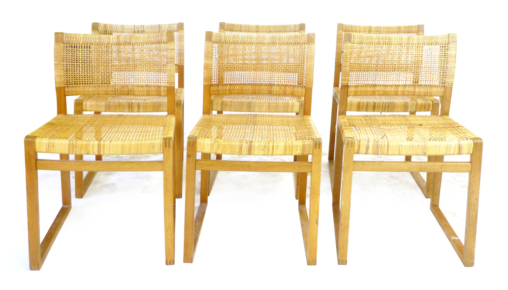 A set of six oak framed and wicker seated dining chairs on boxed supports CONDITION REPORT: