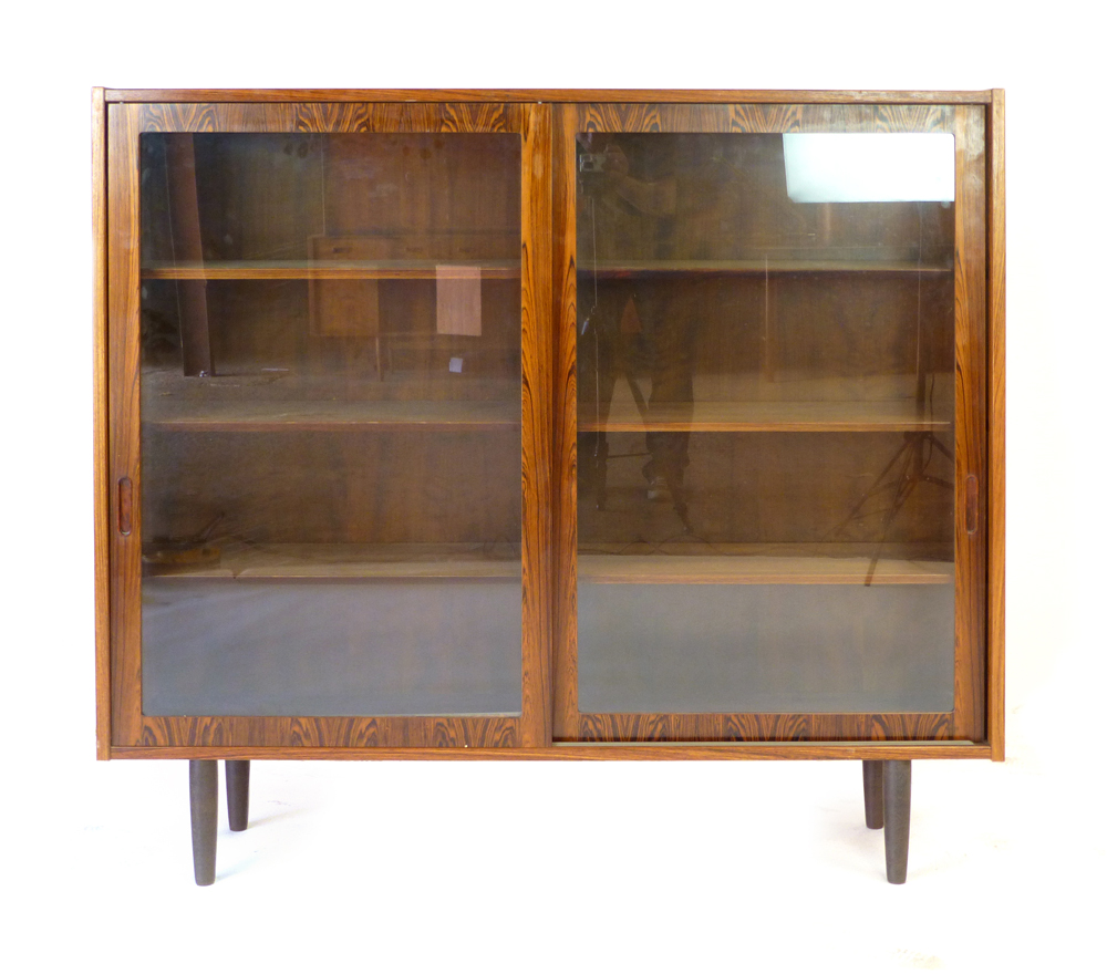 A 1960's rosewood bookcase with twin glazed sliding doors and six adjustable shelves on circular - Image 2 of 13