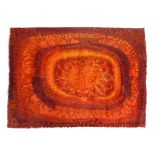 A 1970's woollen rug decorated with red and orange shapes, 128 x 175 cm CONDITION REPORT: Poor