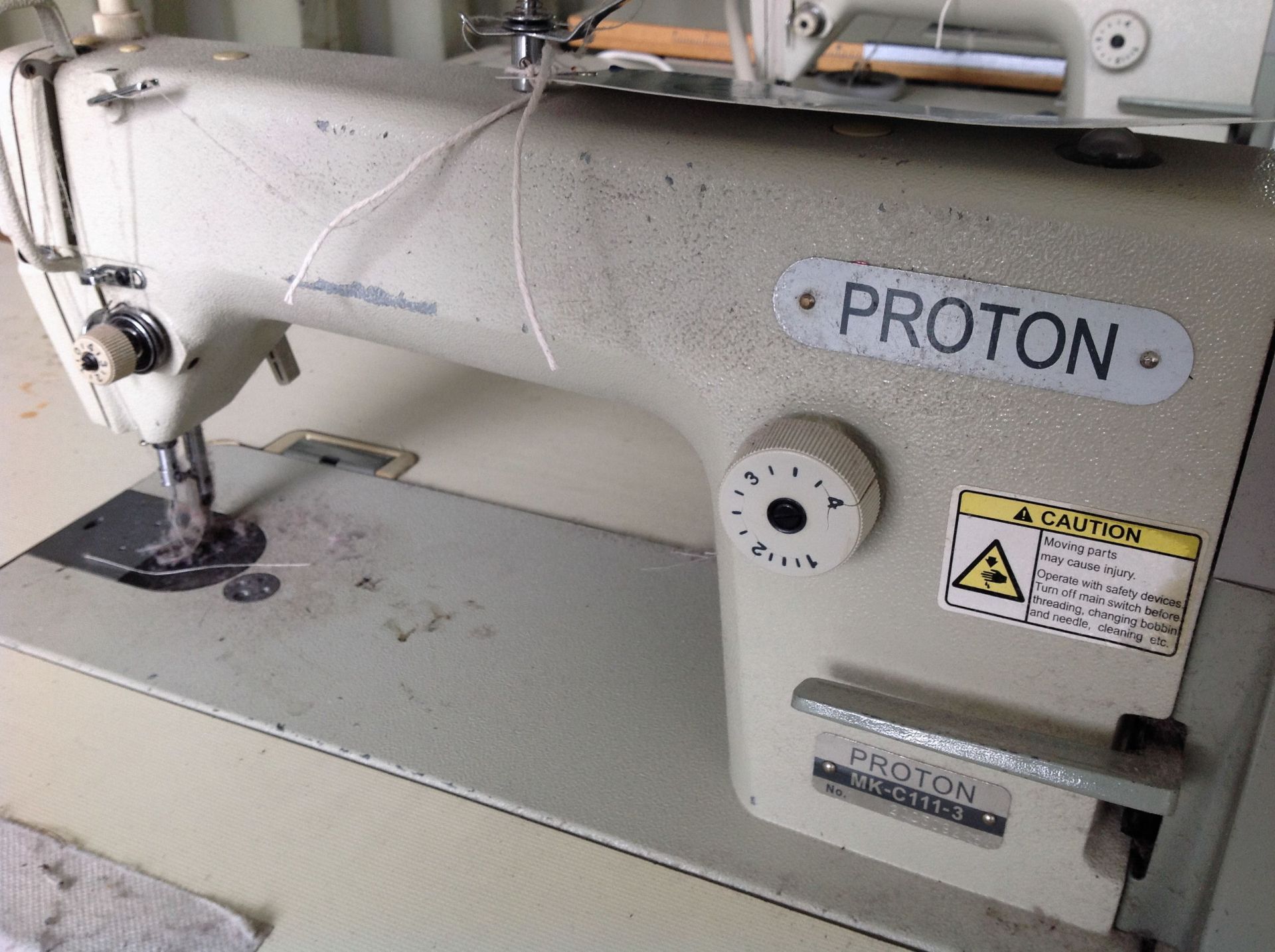 A Proton MK-C111-3 Single Needle Lockstitch Sewing Machine No.2003092684 with power bench (240v).