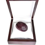 An Impressive 656.00CT Oval Cut Ruby Gemstone, appraised valuation $22,961.00 approx £14,657.98