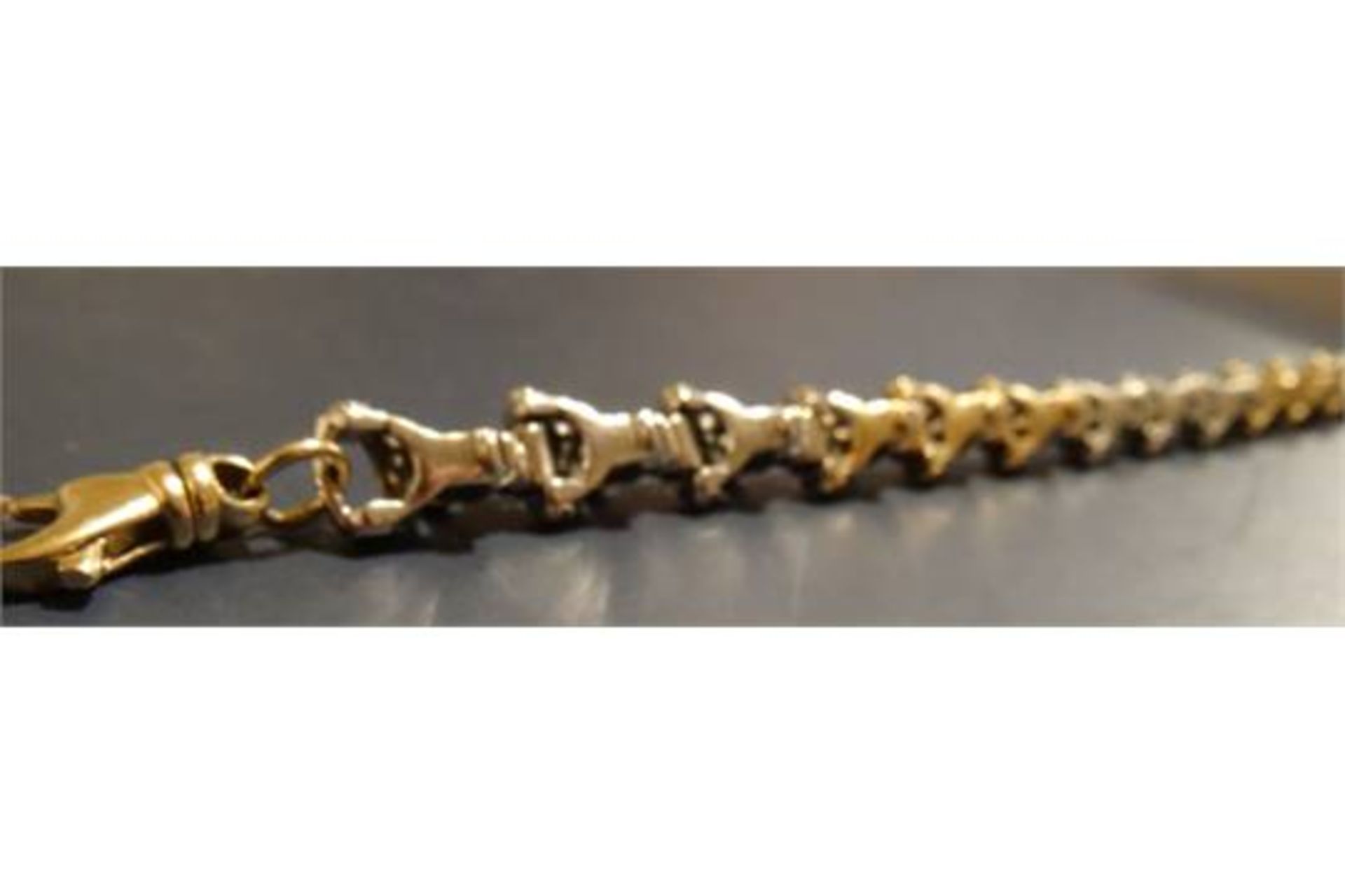 9 Carat Yellow and White Gold 9 Inch Fancy Link Bracelet. Weighing 34.29G. Comes with an independent