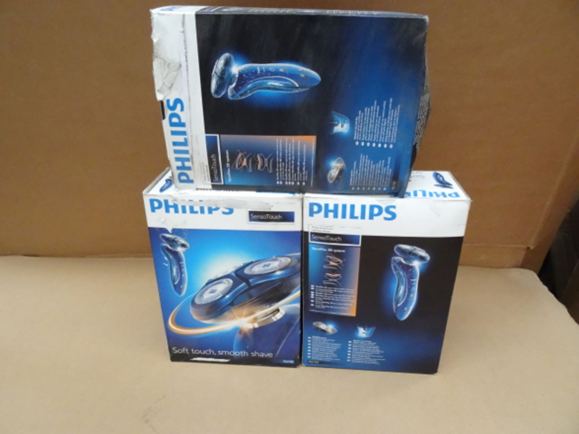3 x Philips SensoTouch RQ1150 Electric Shaver. •GyroFlex 2D system adjusts easily to the curve
•