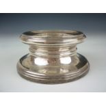 A Late 20th Century silver candle holder or 
stand. 12 cms x 5 cms base loaded