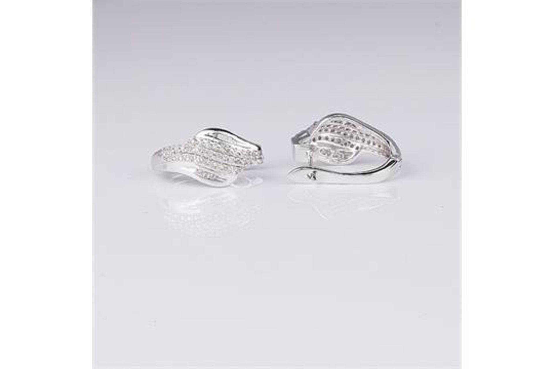 An attractive 0.42 carat Mixed Cut 90 Diamonds And Rhodium Over Silver Earrings  appraised by