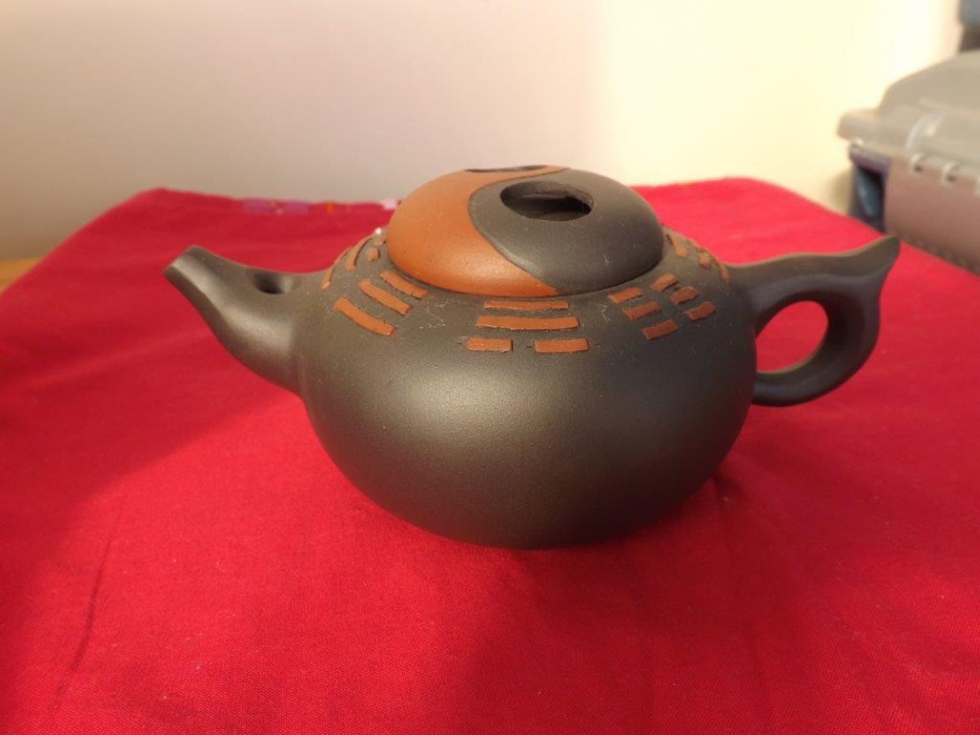 A Chinese Yixin Teapot of compressed form
Insided characters to body.  Impressed seal mark