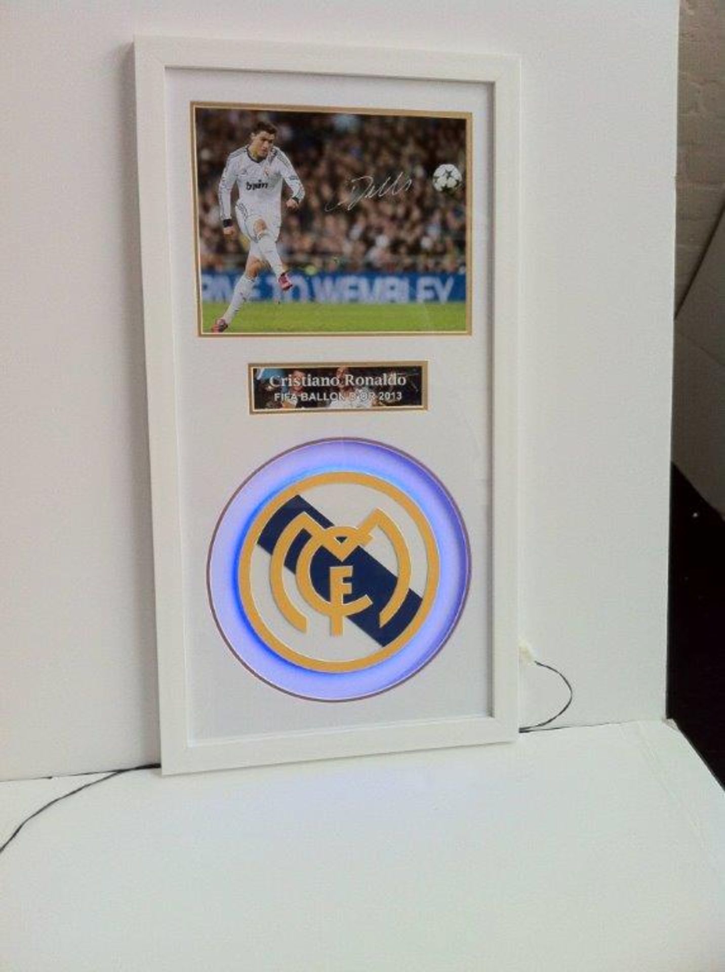 RONALDO signed photo with illuminated club badge (blue lights)  Estimated value £250. Size 20x38