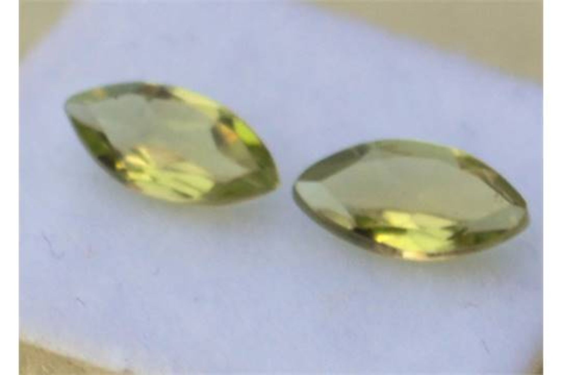 1.79 carat pair of matched marquise cut peridot, these gemstones are totally natural, they have
