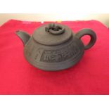 A Chinese Yixin Teapot of compressed form
incised character to body  Impressed seal mark