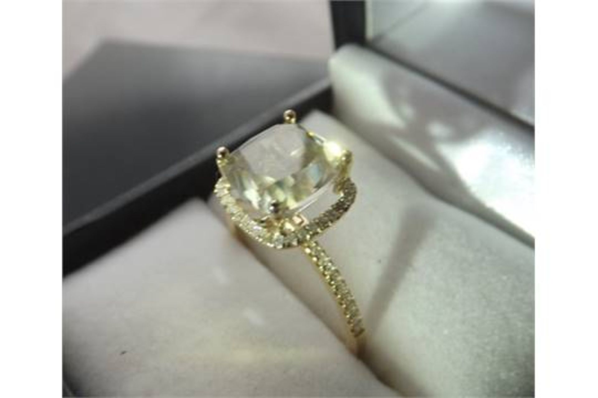 A 4.5 Carat fancy coloured diamond ring claw-set.