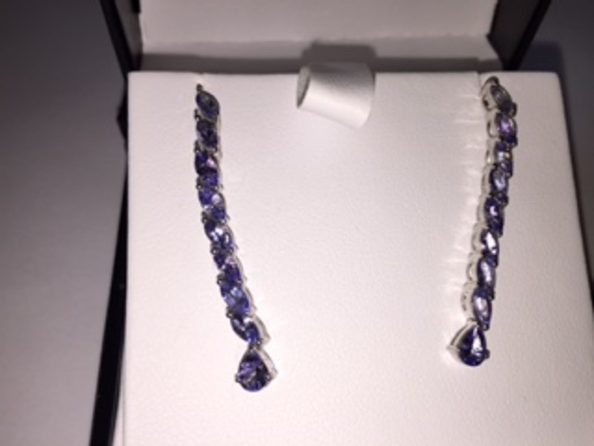 Earrings 
stunning 2.65 carat mixed cut Tanzanite gemstones in a Platinum over silver earings