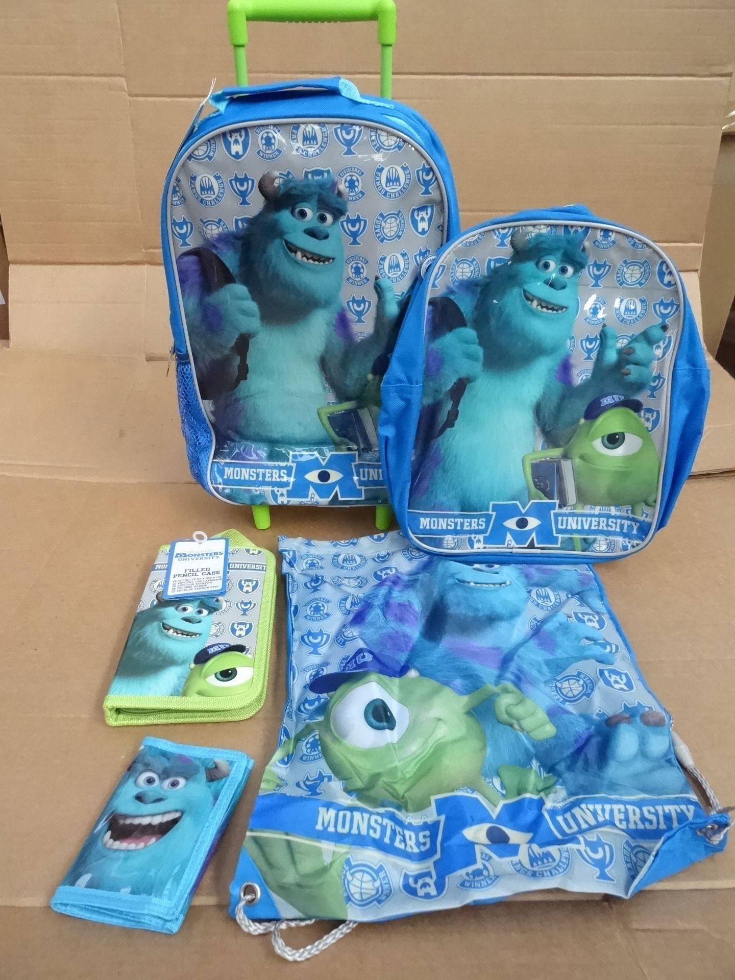 24 x Disney Monsters University 5 Piece Kids Luggage sets. Each includes wheeled holdall, back pack,