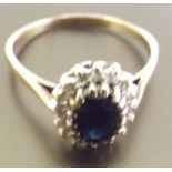 A Saphire and Diamond cluster ring, A stunning Blue Sapphire surrounded by diamonds, set in 9