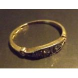 A three stone Diamond trilogy ring, set in 9 carat gold