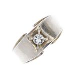 A diamond single-stone 14K White gold ring. The brilliant-cut diamond, within a square-shape