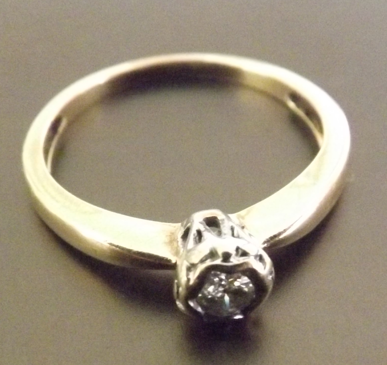 A single stone diamond solitaire ring, a brilliant cut single stone diamond of around .25 carats set